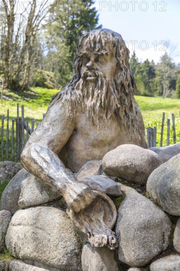 Figure of the river god Danuvius by sculptor Wolfgang Eckert at the source of the Breg, source of