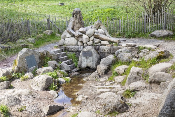 Figure of the river god Danuvius by sculptor Wolfgang Eckert at the source of the Breg, source of