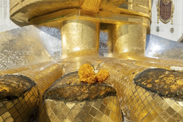 Feet of a 32 metre high standing Buddha decorated with glass mosaics and 24-carat gold, Luang Pho