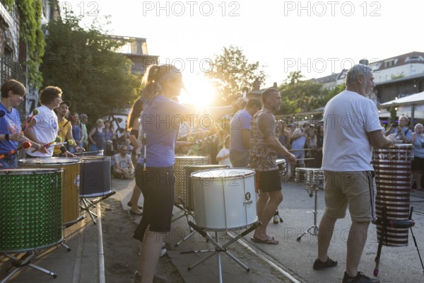 The band Berlin Percussion plays on the RAW grounds as part of the Fête de la Musique. The music