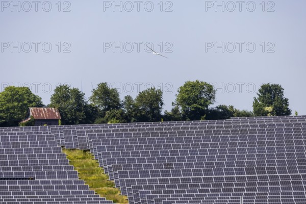 Open-space photovoltaic system, solar park near Nellingen in the Swabian Alb. Glider. Nellingen,