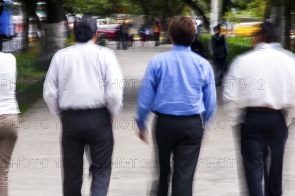 Men walking in street, Photo with motion blur, City of Quito, Pichincha province, Ecuador, South