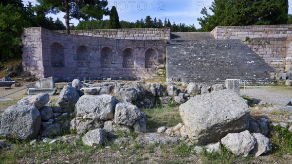 Roman theatre with arches and stone ruins in a natural setting, flight of steps, second terrace,