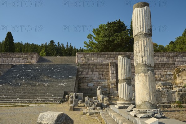 Ruins with broken columns and stone steps under a blue sky, Asklepios Temple, Asklipion,