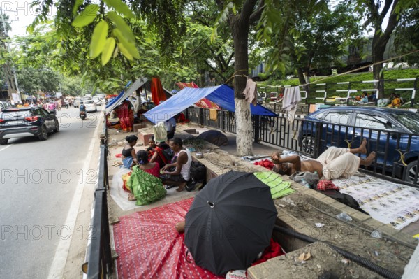Devotees staying in street divider as they arrives to visit Kamakhya Temple during Ambubachi Mela,