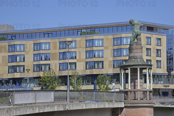 Sculpture raftsman by Rob Krier 1989, monument to the historical tradition of rafting on the river