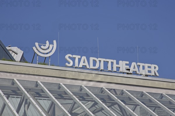 Roof with white inscription city theatre, modern building, emblem, cut-out, detail,