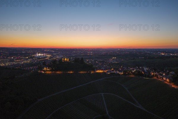 Expansive city view at dusk, with illuminated chapel and vineyards, grave chapel, Zum Württemberg,