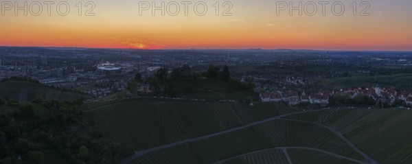 Panoramic view of the city with vineyards and houses in the foreground at sunset, grave chapel, Zum