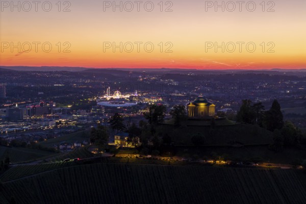 Panoramic view of an illuminated town and chapel at sunset, grave chapel, spring festival, Zum