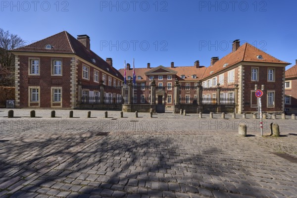 Episcopal Vicariate General, vicariate, brick building, bollards, cobblestone pavement, blue