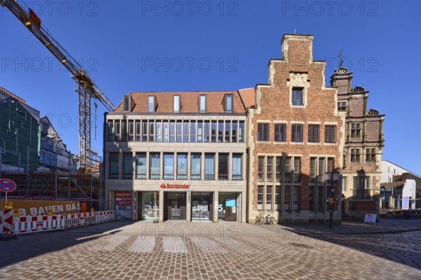 Contrast, modern versus historical architecture, brick building, branch of Santander, facade,