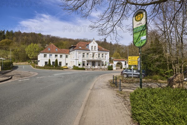 Hotel and restaurant Wittekindsquelle, building, bus stop church, pavement, concrete paving stones,