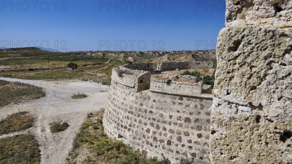 Bastion, Defence walls, Massive stone fortifications in a dry, extensive landscape, Antimacheia,