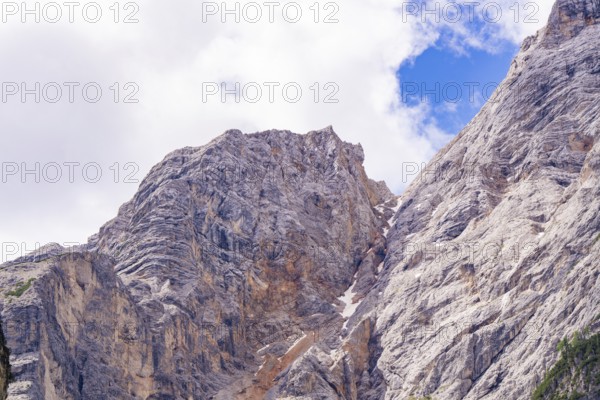 Stony mountain landscape under a blue sky with scattered clouds, Alpe di Siusi, South Tyrol,