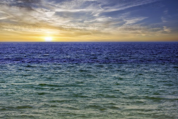 Turquoise blue sea, calm water surface, sunset, offshore island of Heligoland, Schleswig-Holstein,