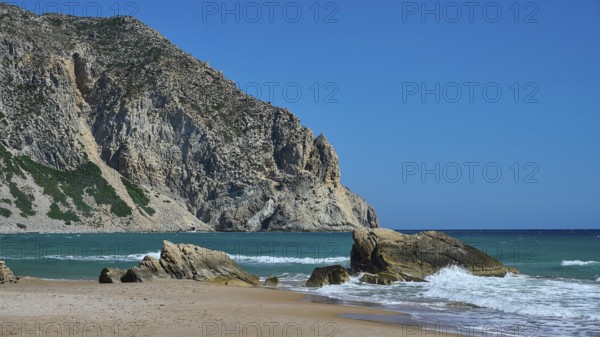 Beach, Kavo Paradiso, Paradise Beach, beach with rocky coast and clear blue sky by the sea,