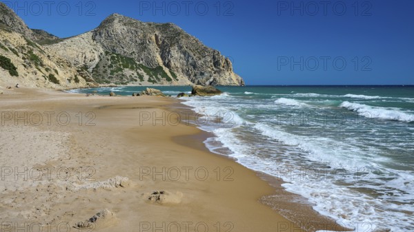 Beach, Kavo Paradiso, Paradise Beach, Extensive sandy beach with gentle waves under a blue sky,