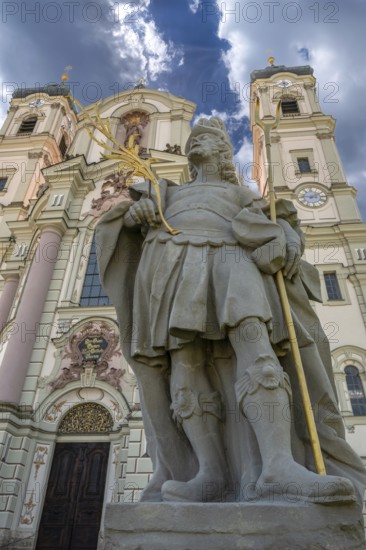 Sculpture of the church patron St Theodore in front of the east tower of the baroque Basilica of St