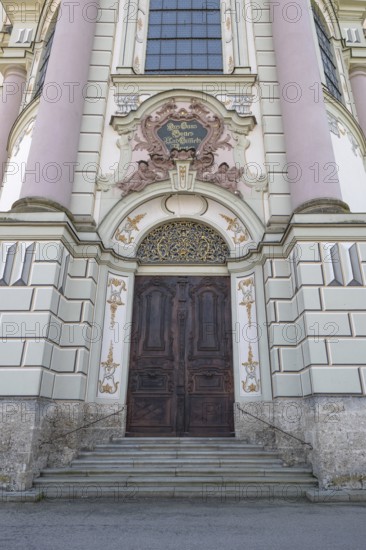 Side entrance portal of the east tower of the baroque Basilica of St Alexander and Theodor,