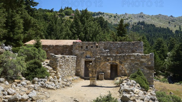 A small ancient ruin complex in a wooded area under a sunny sky, Abandoned Village, Lost Place,