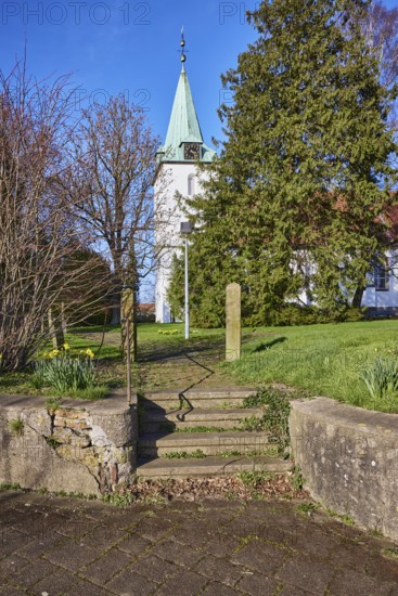 Evangelical Lutheran Church Hille, wall, stairs, bare wintry trees, blue cloudless sky, Eickhorster