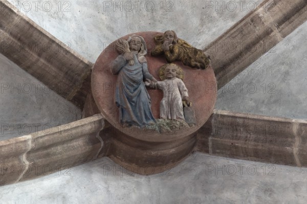 Mary dragging the infant Jesus into the school, keystone in the altar vault of the Church of Our