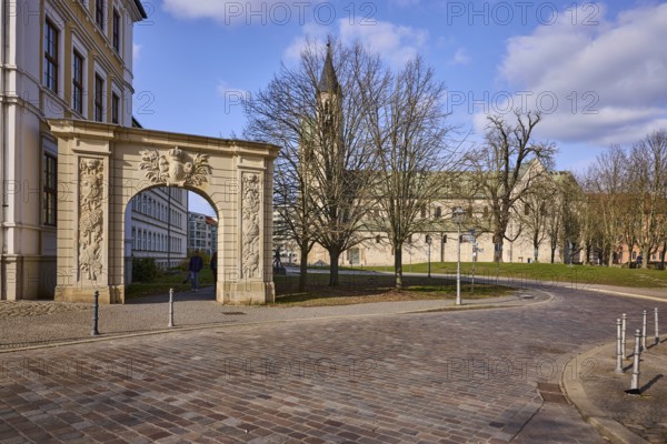 Stargate at the cathedral square, archway, bollards, monastery, church, bare winter trees, baroque