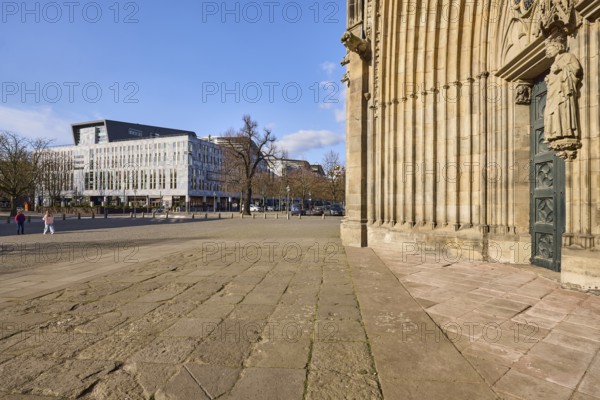 Magdeburg Cathedral, entrance, modern architecture, bare winter trees, pavement made of sandstone