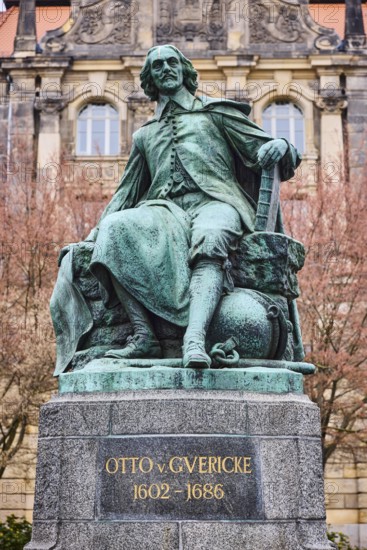 Monument to Otto von Guericke, sandstone building, public order office, bare winter trees, historic