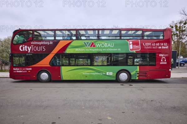 Tourist information, CityTours, tourism, bus for city tours, old town, diffuse light, milky blue