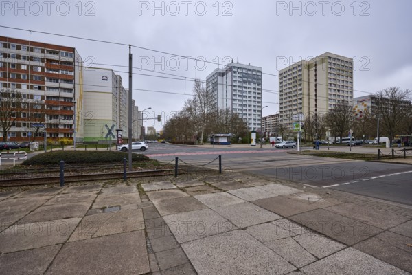 High-rise buildings, residential buildings, residential silos, tram tracks, overhead lines, diffuse