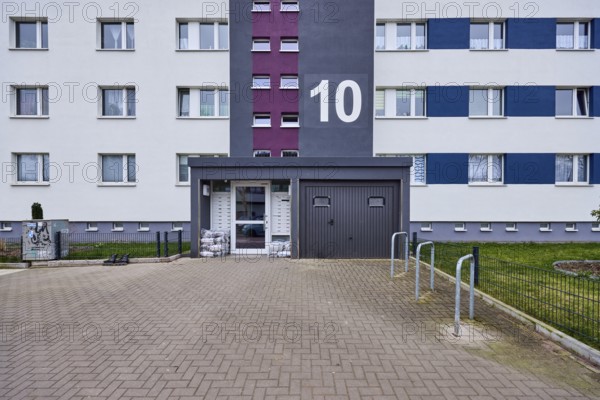 High-rise building, residential building, façade, entrance area, window, door, house number,