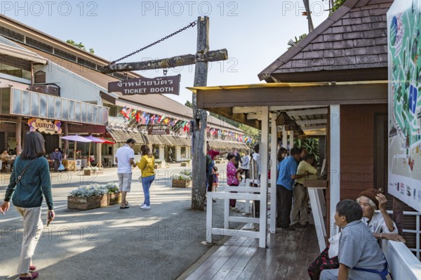 Visitors line up to purchase admission tickets to various parts of the Doi Tung tourist attraction