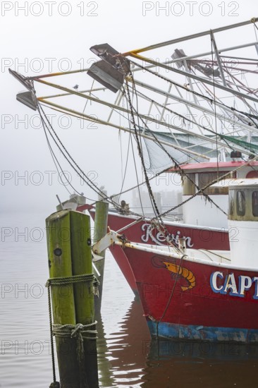 Commercial shrimp boats at the dock in the commercial area of the Biloxi Small Craft Harbor in