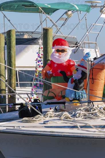 Inflatable Christmas decorations on the deck of a boat at the Biloxi Small Craft Harbor in Biloxi,