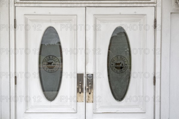 Etched glass entry doors to the Blue Bell Creameries Country Store and Ice Cream Parlor in
