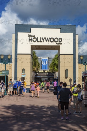 Entrance to Disney's Hollywood Studios theme park with sign mandating masks to contain the spread