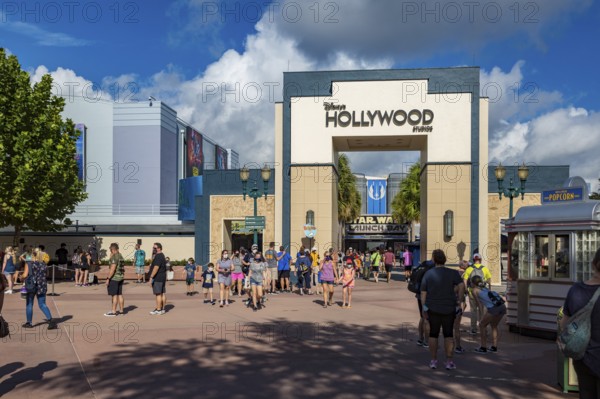 Entrance to Disney's Hollywood Studios theme park with sign mandating masks to contain the spread