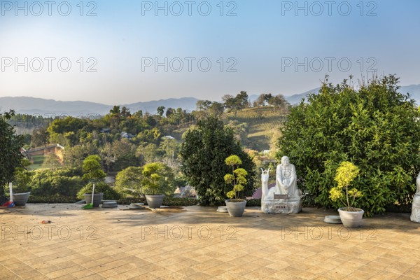 Statue at base of the Guan Yin (Goddess of Mercy) statue at Wat Huay Pla Kang Temple in Chiang Rai