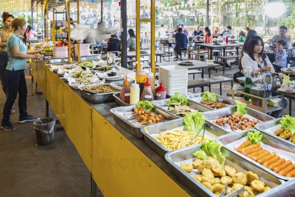 Selection of prepared foods available for customers at a buffet style outdoor restaurant in Chiang