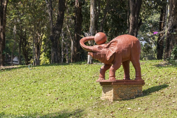 Statue of an elephant with a ball on the campus of CRRU Shiangrai Rajabhat University in Chiang