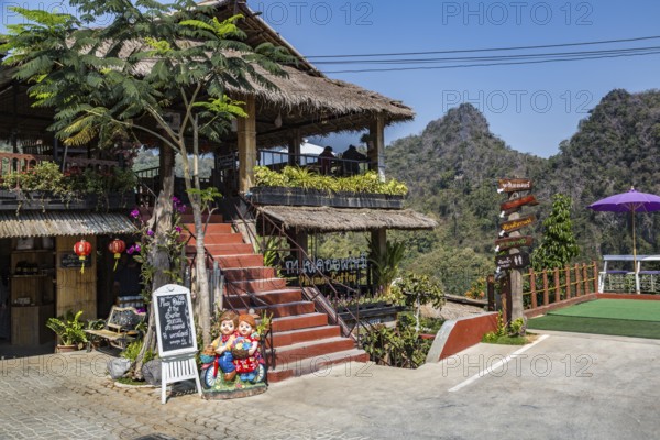 Stairs lead up to the dining area and down to the gardens at the Doi Phamee coffee shop and