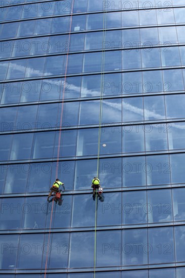 Detroit, Michigan - Window washers at the 25-story Residences Water Square luxury apartment