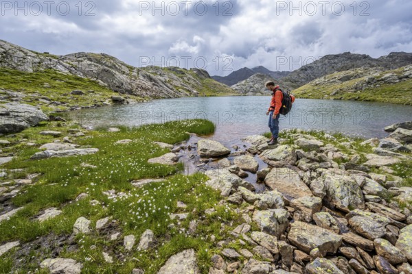 Mountaineer at a mountain lake in high mountain landscape at the Upper Senner Egete, Seven Lakes