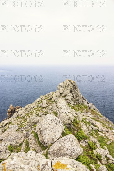 Rocky peninsula with a sea view to the horizon on a desolate sea in the summer, Crozon peninsula,