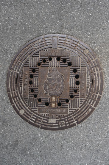 Manhole cover with the coat of arms of Burglengenfeld, Upper Palatinate, Bavaria, Germany