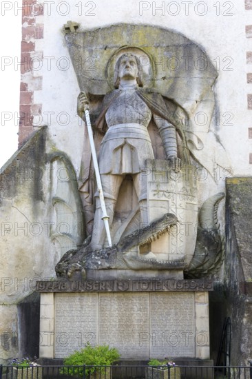 St George the Dragon Slayer with dragon on the exterior façade of St Martin's Church in Endingen am
