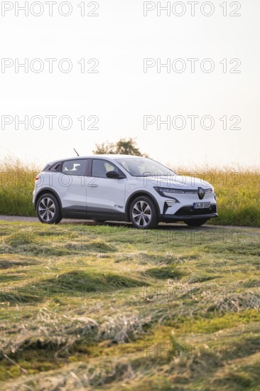 White car on a rural road in Sommerfeld, Renault Megane, Deer E Carsharing, electric car, Calw,