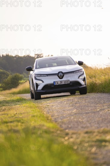 White car driving on a rural road in summer, Renault Megane, Deer E Carsharing, electric car, Calw,